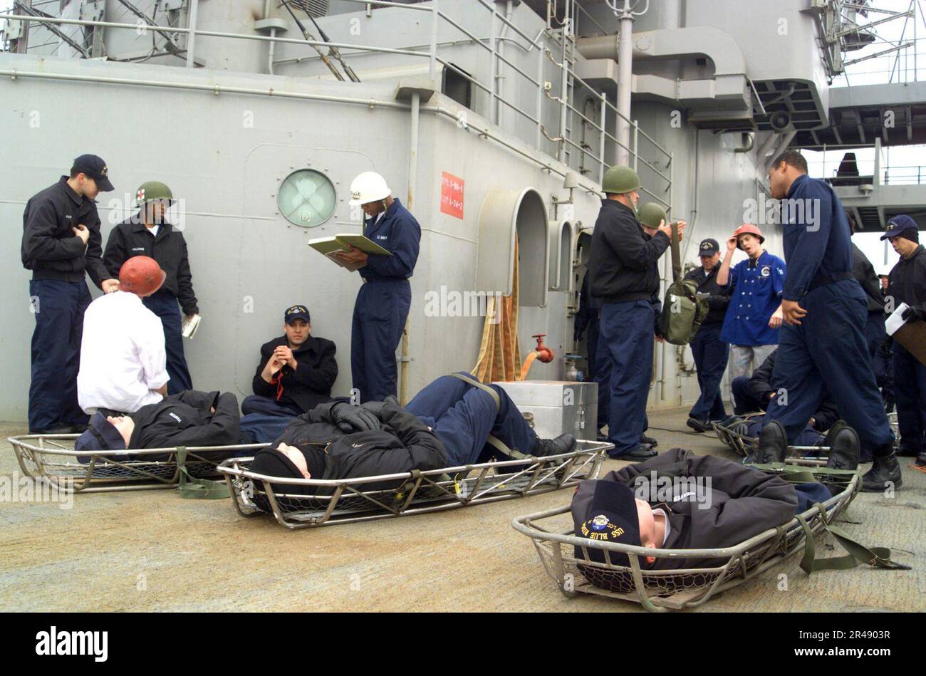 US Navy Simulated personnel casualties lie in stretchers at a medical