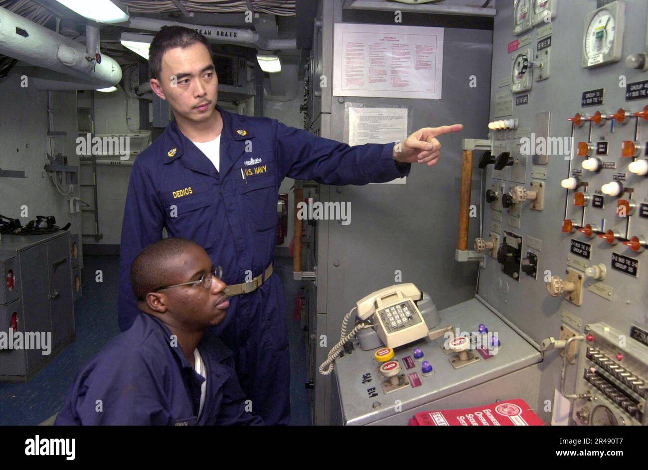 US Navy Training in the Number 2 auxiliary machinery room aboard USS ...