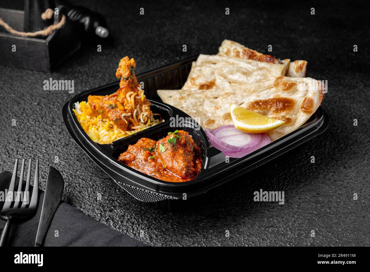 A Chicken Biryani with buttered chicken and parotta bread meal Stock Photo