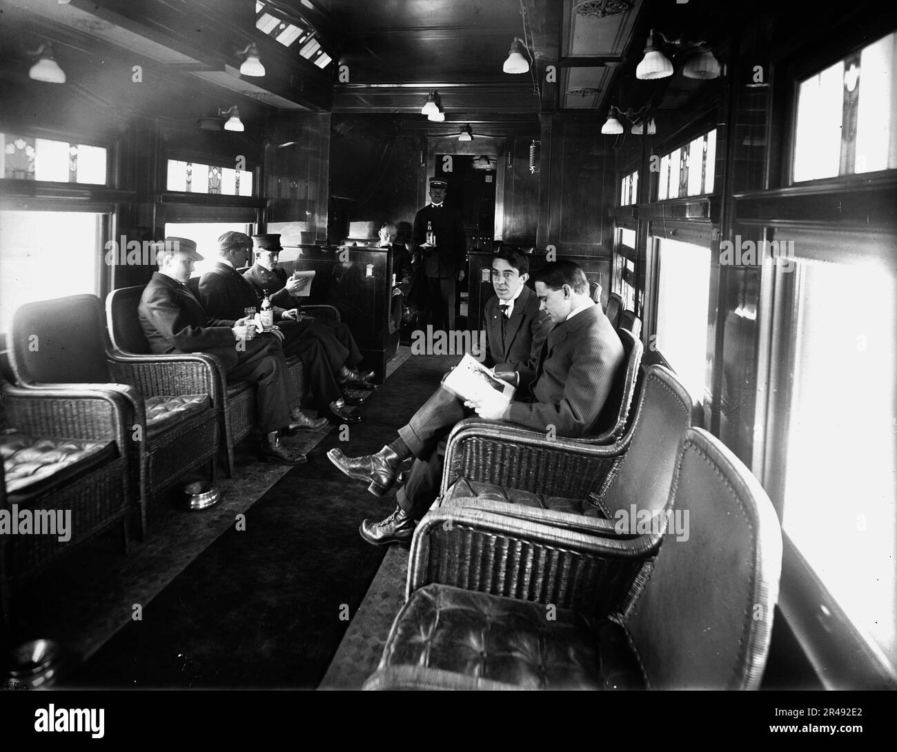 Buffet library car on a deluxe overland limited train, between 1910 and 1920. Stock Photo