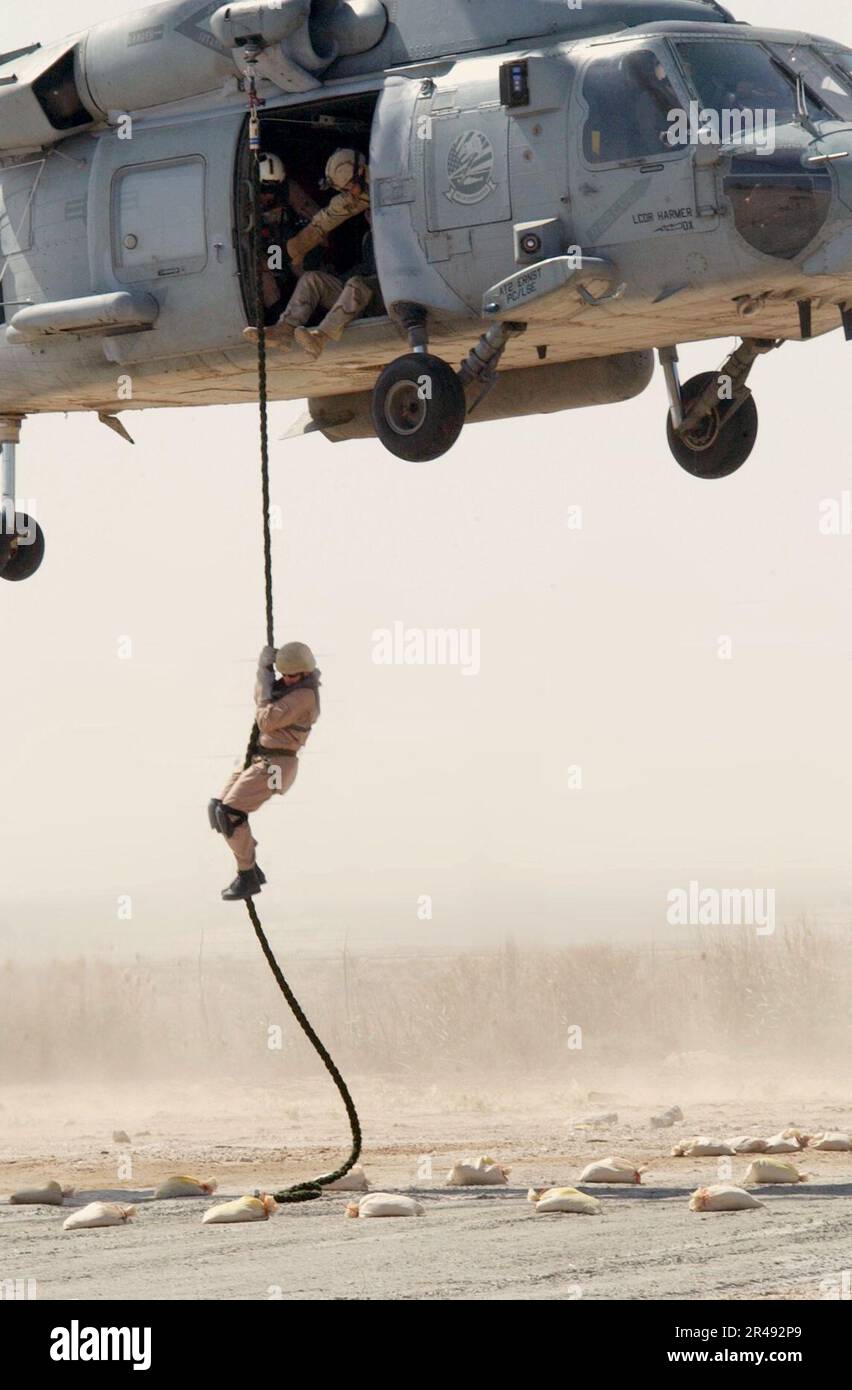 US Navy A member of a Naval Special Warfare team conducts a fast rope