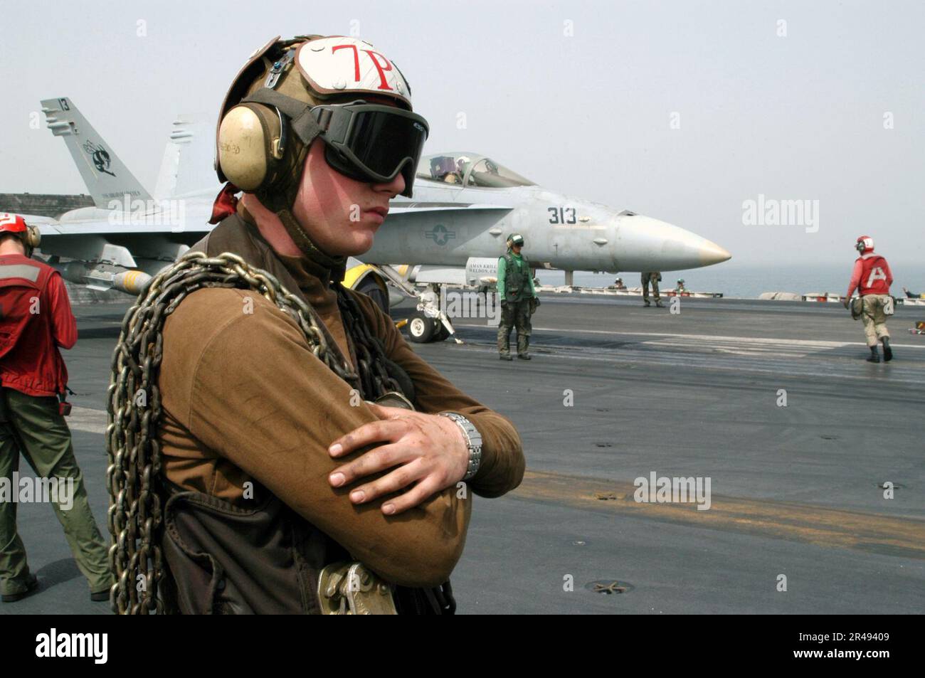 US Navy Personnel assigned to the line shack stand by with Mark One tie