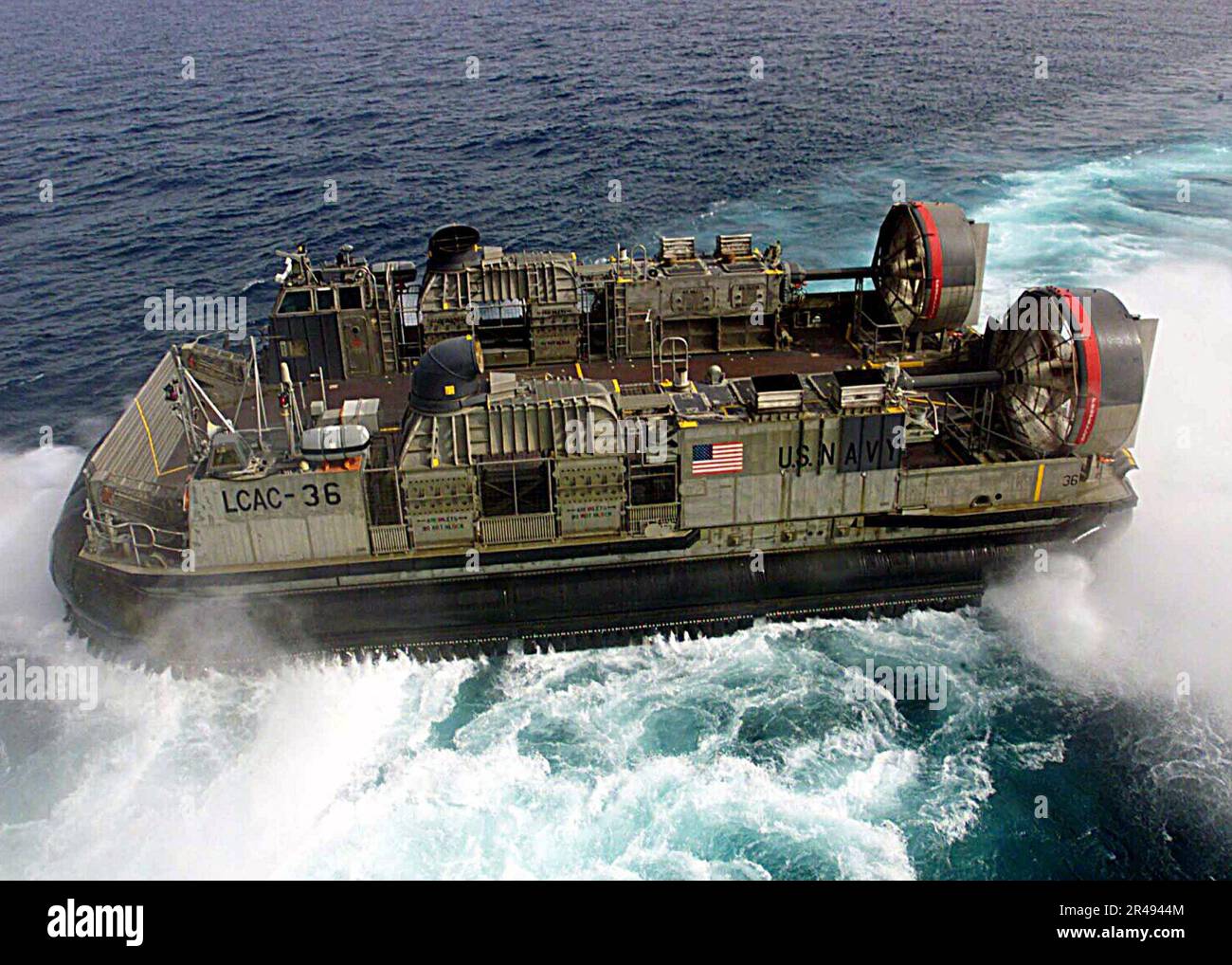 US Navy Hopper 36 from Assault Craft Unit Four (ACU-4) departs the USS ...
