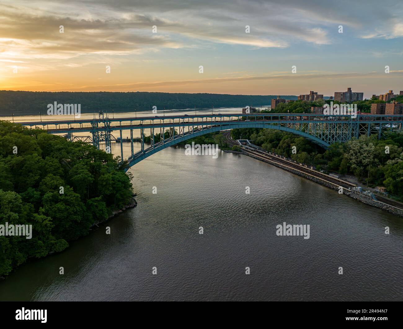 An aerial view of the Henry Hudson Bridge, crossing the Spuyten Duyvil Creek at sunset in New York. Stock Photo