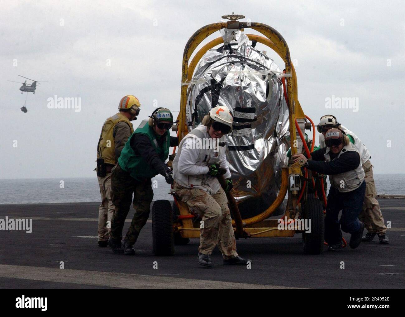 US Navy The supply department crew aboard USS Carl Vinson (CVN 70) pull