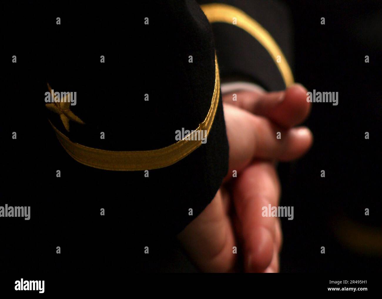 US Navy Direct Commission Officer (DCO) candidate stands at parade rest