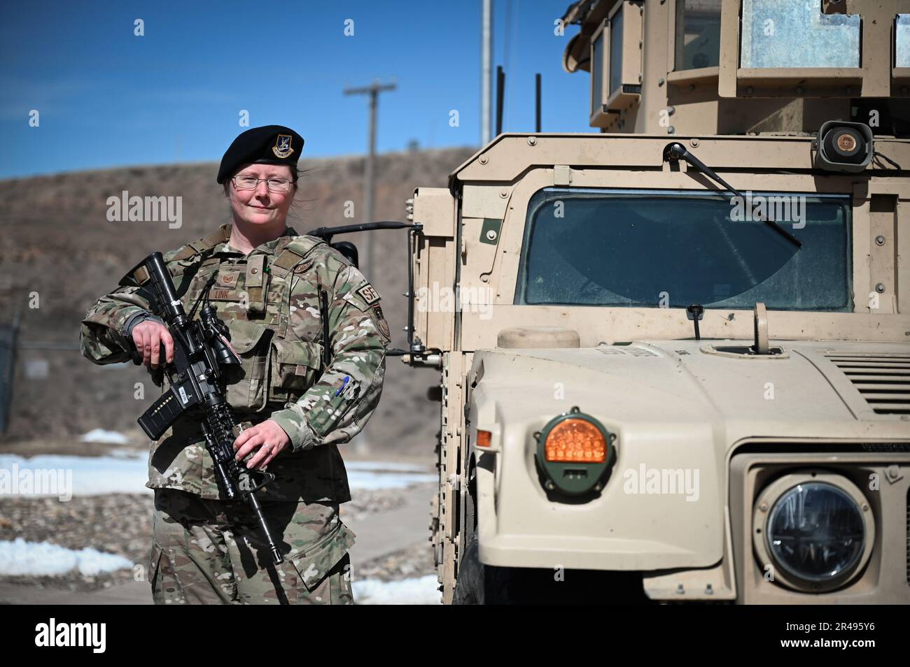 Tech. Sgt. Stacey Link, 341st Missile Security Forces Squadron flight security controller, poses for a portrait beside a ballistic engineered armored response counterattack truck on Alpha-01 missile alert facility March 23, 2023, near Malmstrom Air Force Base, Mont. Link is responsible for the secure entry and exit of all personnel at Alpha-01 MAF. Stock Photo