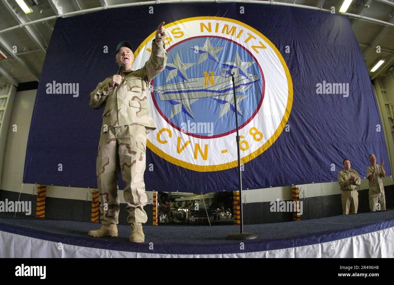 US Navy Commander, U.S. Naval Forces Command, U.S. Fifth Fleet Vice. Adm. Timothy J. Keating, address the crew aboard USS Nimitz Stock Photo