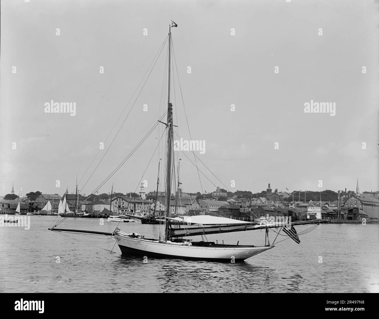Tomboy, between 1880 and 1899. Photo shows the yacht Tomboy in Newport, Rhode Island, harbor. (Source: C. Ipcar and J. and D. Howard, 2023) Stock Photo