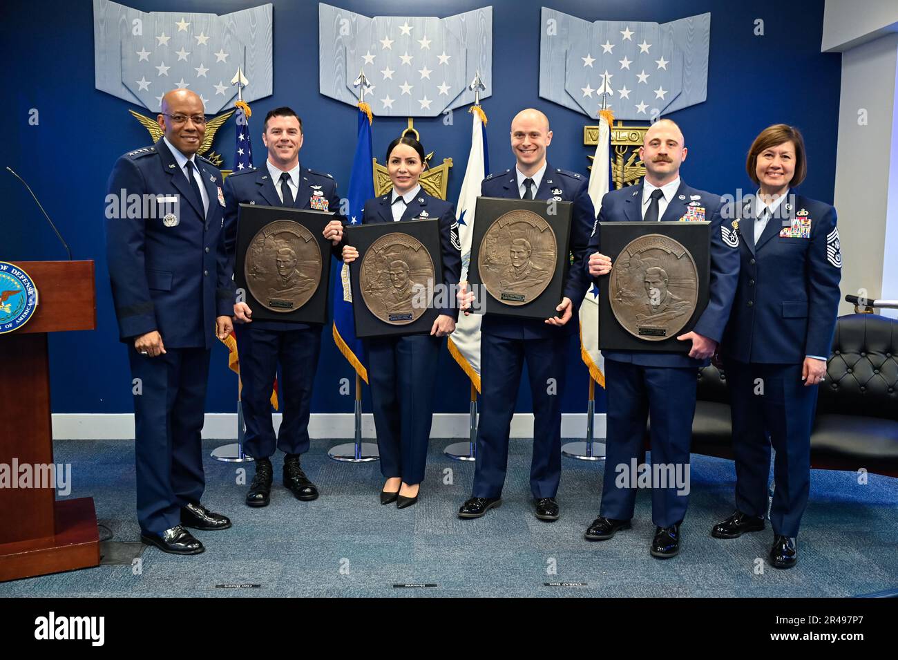 Air Force Chief of Staff Gen. CQ Brown, Jr. and Chief Master Sgt. of the Air Force JoAnne S. Bass pose with Lt. Col. Morgan Laird, second from left, Senior Master Sgt. Karla Pelayo, Capt. Christopher Locke and Tech. Sgt. Connor Hamilton, recipients of the 2022 Lance P. Sijan USAF Leadership Awards, during a ceremony at the Pentagon, Arlington, Va., April 3, 2023. The award is named for Medal of Honor recipient Capt. Lance Sijan, who died while being held as a prisoner of war during the Vietnam War. Stock Photo