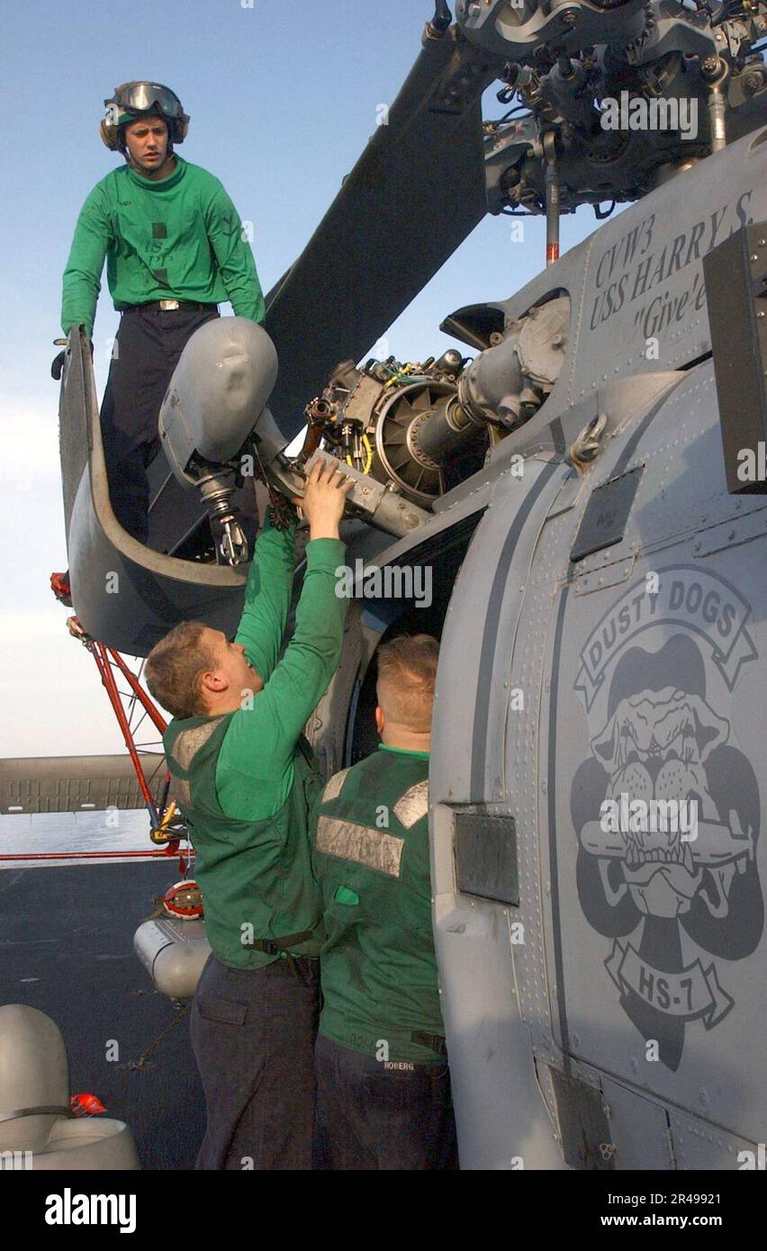 US Navy Aviation Machinist's Mates perform preventative maintenance on ...