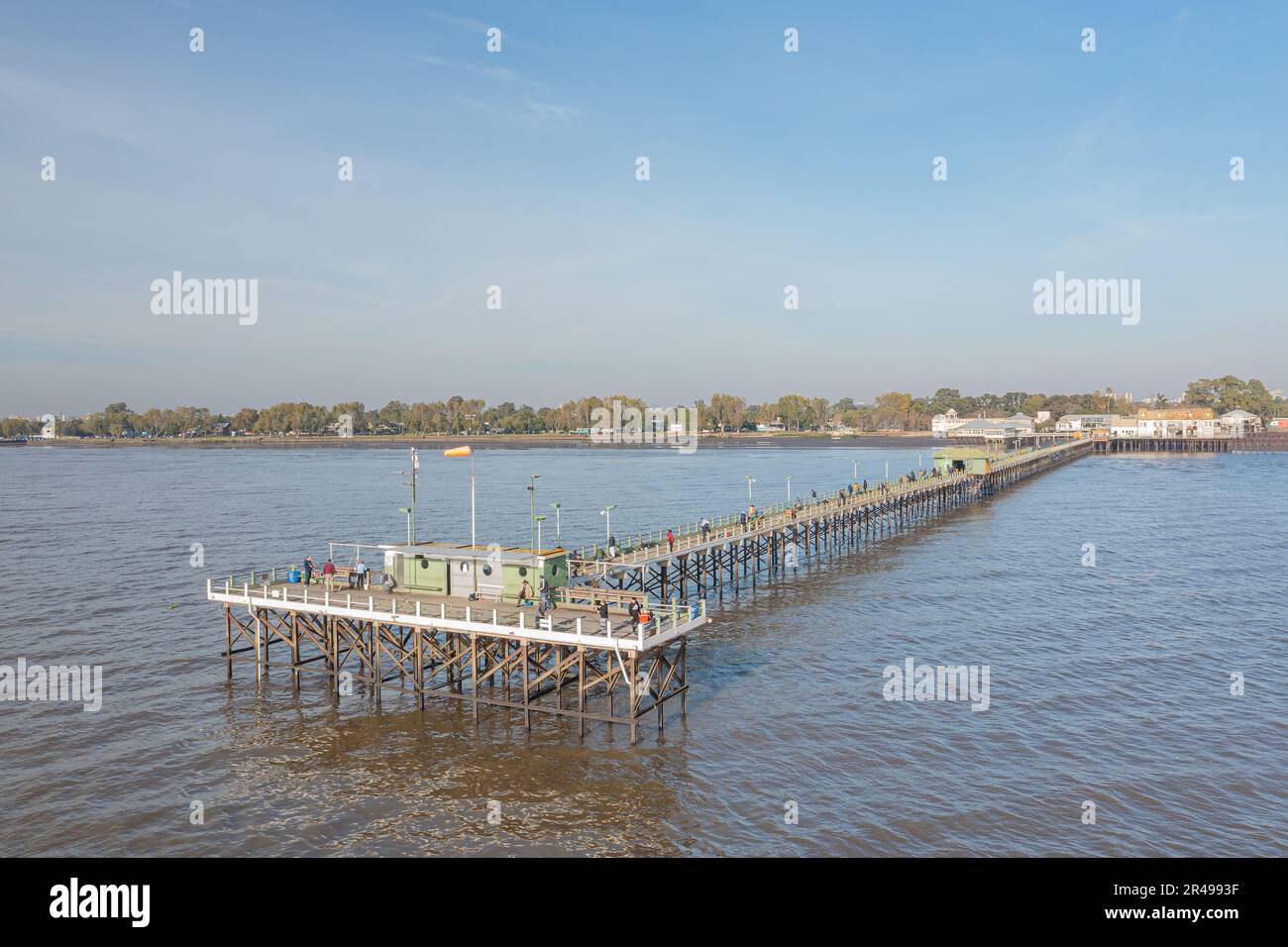 Buenos Aires, Argentina - May 16th, 2023: Fishermen on a dock in the Rio de la Plata on the Quilmes waterfront. Stock Photo
