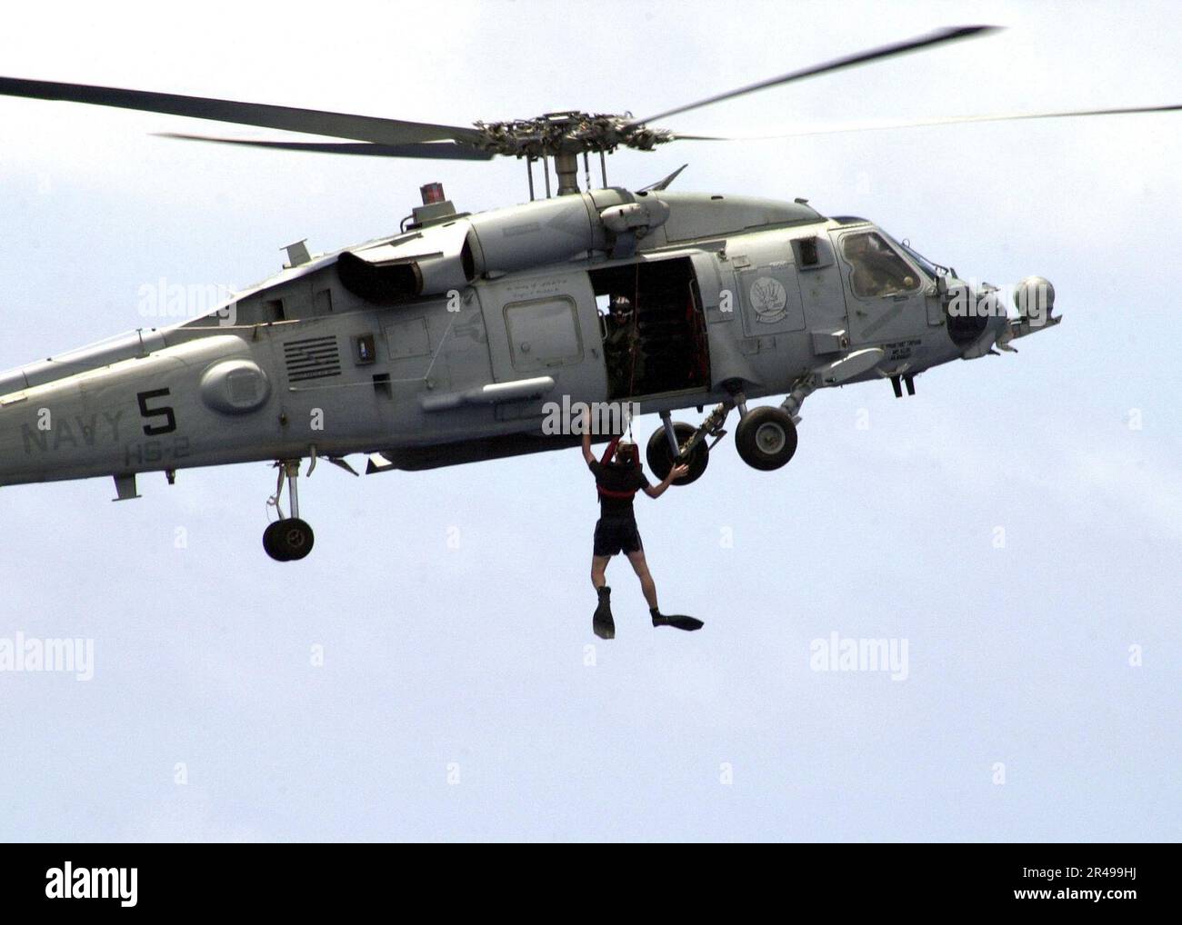 US Navy Seahawk demonstrates raising a Search and Rescue (SAR) swimmer Stock Photo Alamy