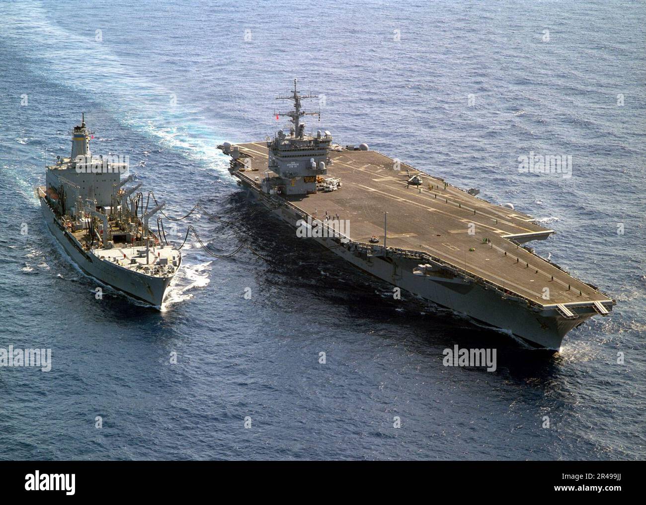 US Navy The USS Enterprise (CVN 65) steams alongside the Military ...