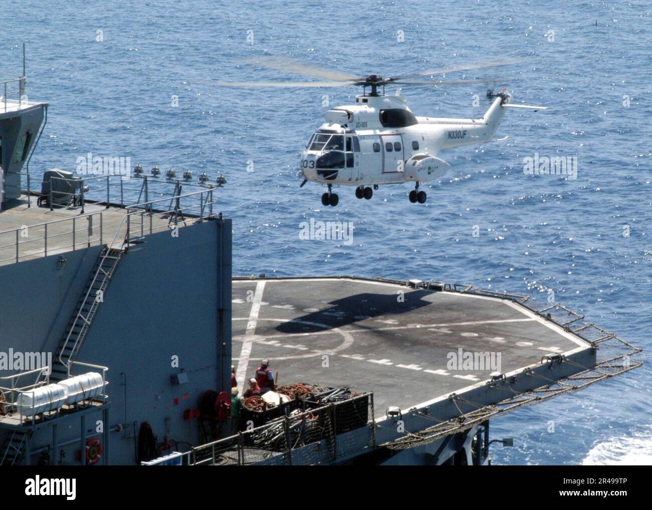 US Navy Hovering above the Military Sealift Command (MSC) combat stores