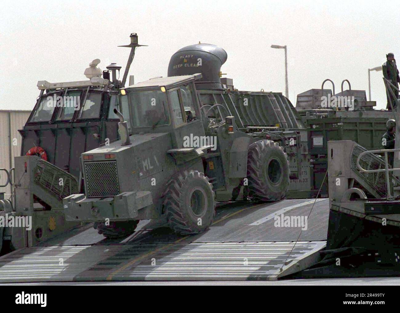 US Navy Marine Corps equipment is loaded onto a Landing Craft Air