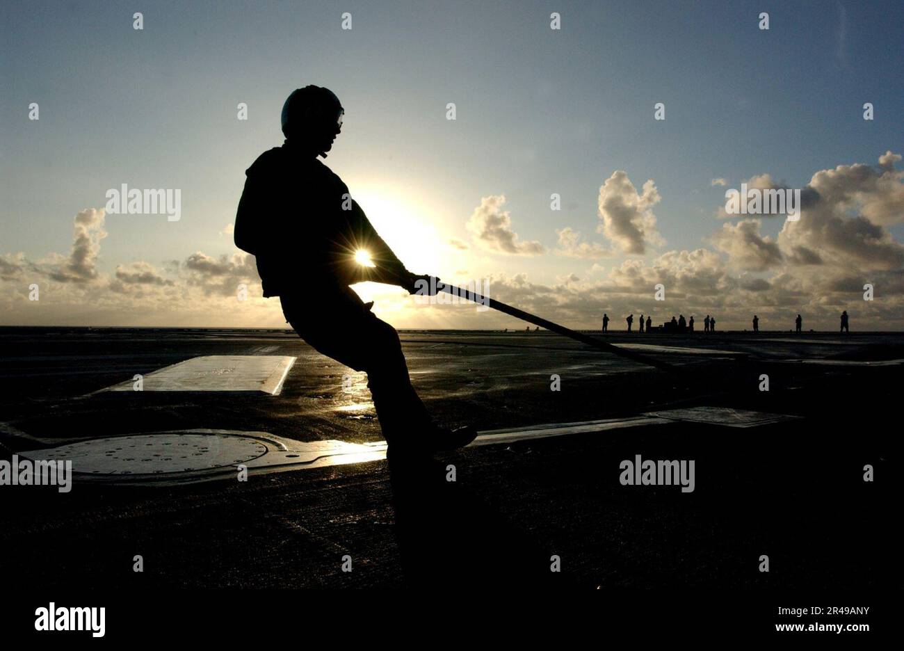 US Navy An Aviation Boatswain's Mate prepares to rig an arresting gear