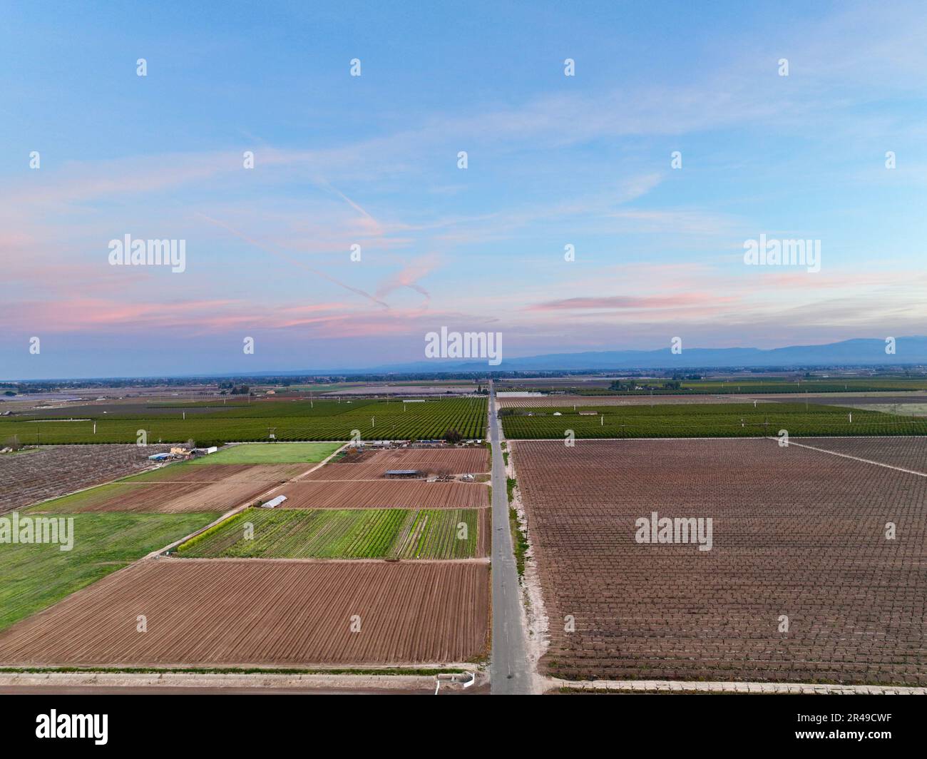An Aerial view of vast, barren fields beneath a splendid blue sky Stock