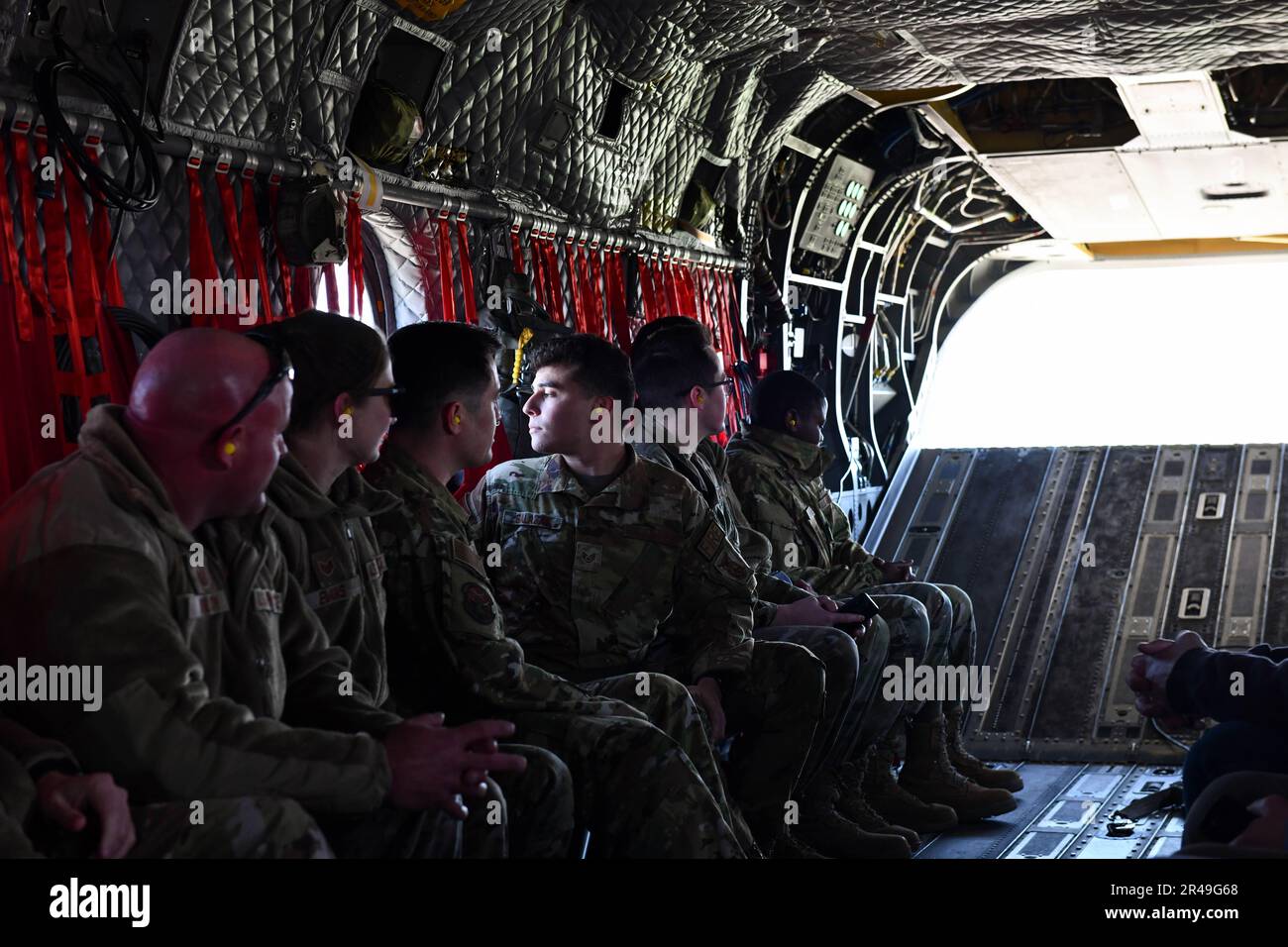 U.S. Air Force Staff Sgt. Jeremy Salazar looks out the window of an airborn CH-47F Chinook March 30, 2023, Springfield Air National Guard base, Springfield, Ohio. The flight was part of a large-scale readiness exercise for all base personnel. Stock Photo