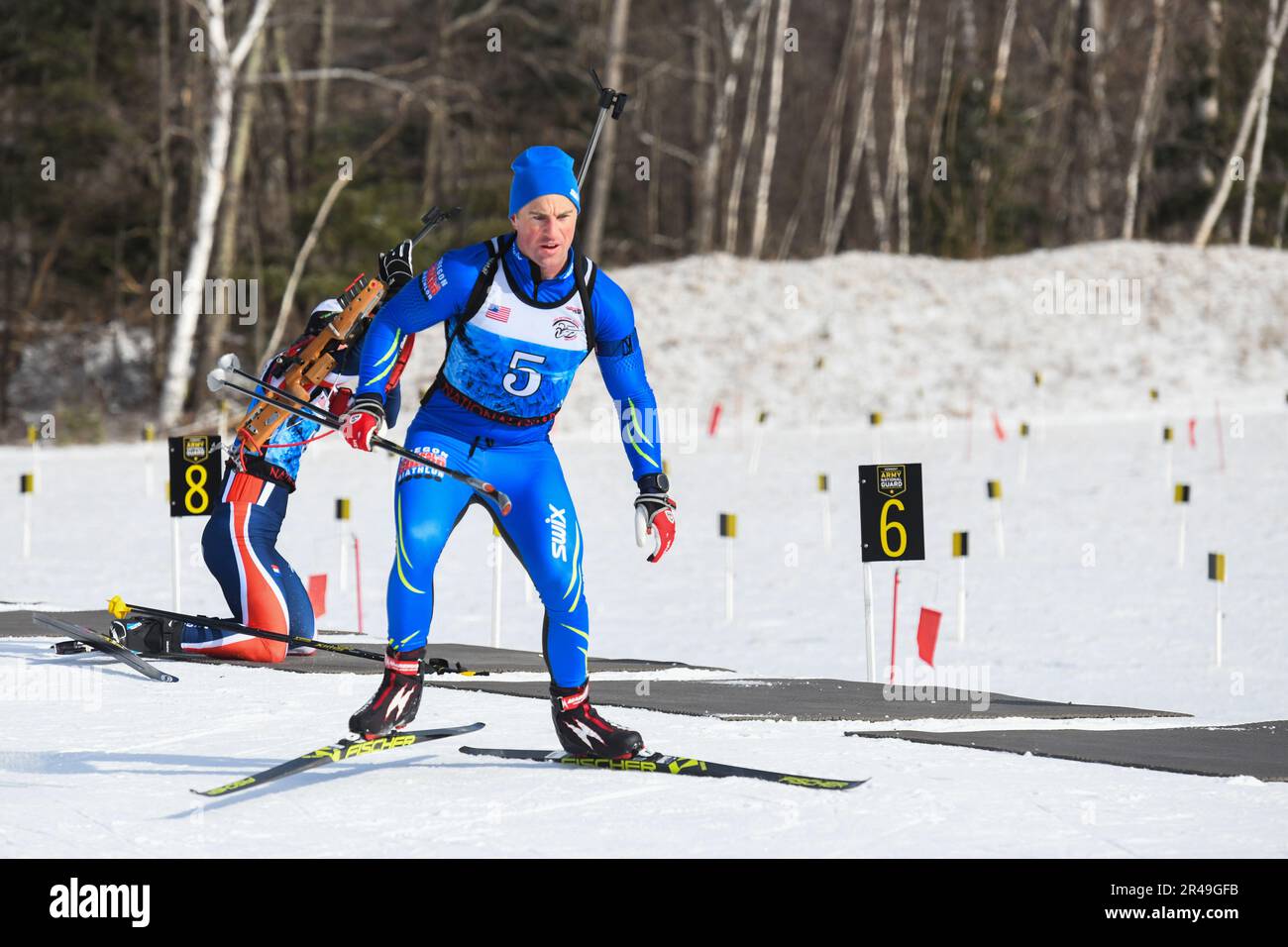 Oregon Army National Guard Capt. Kyle Roe, a troop commander with 1st Squadron, 82nd Cavalry enters the firing range during the Men’s Open Sprint Race at the Chief of the National Guard Bureau’s (CNGB) Biathlon Nationals at the Camp Ethan Allen Training Site in Jericho, Vermont, Feb. 18, 2023. Competitors in both the open and masters categories skied a six kilometer course during the sprint race, while novice competitors, who are new to the sport, completed a three kilometer course. Stock Photo