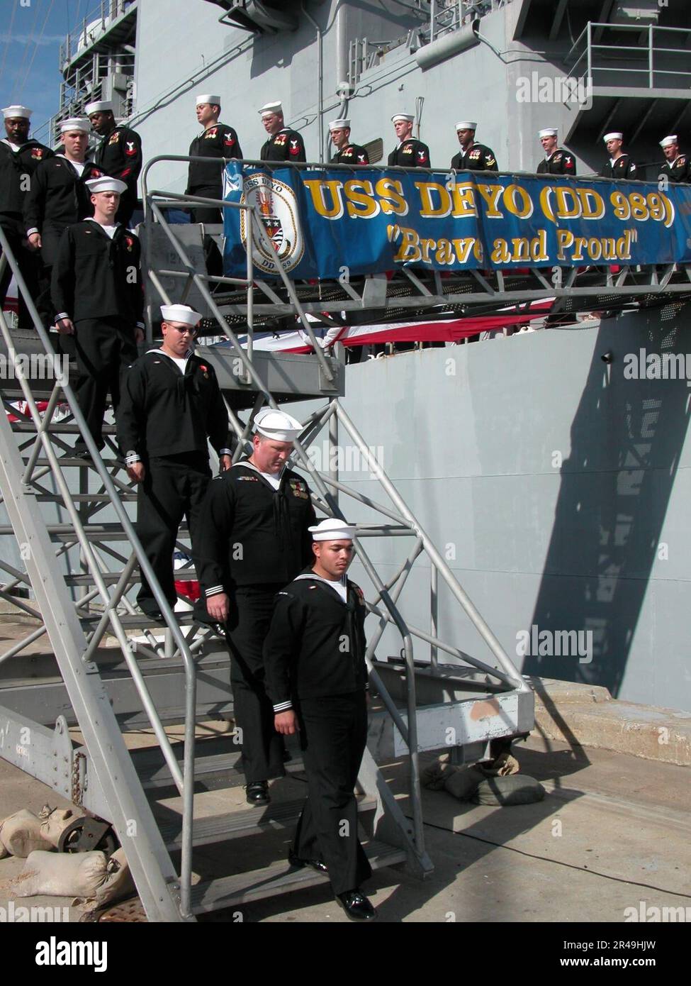 us-navy-sailors-depart-the-ship-for-final-time-during-a-decommissioning-ceremony-stock-photo-alamy