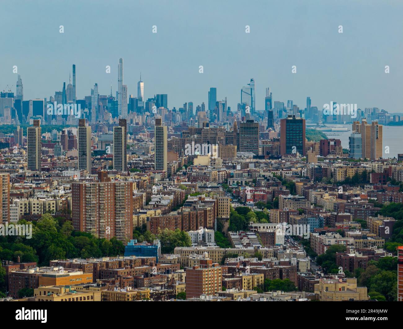 Aerial view of New York City skyline in the distance on cloudy day ...