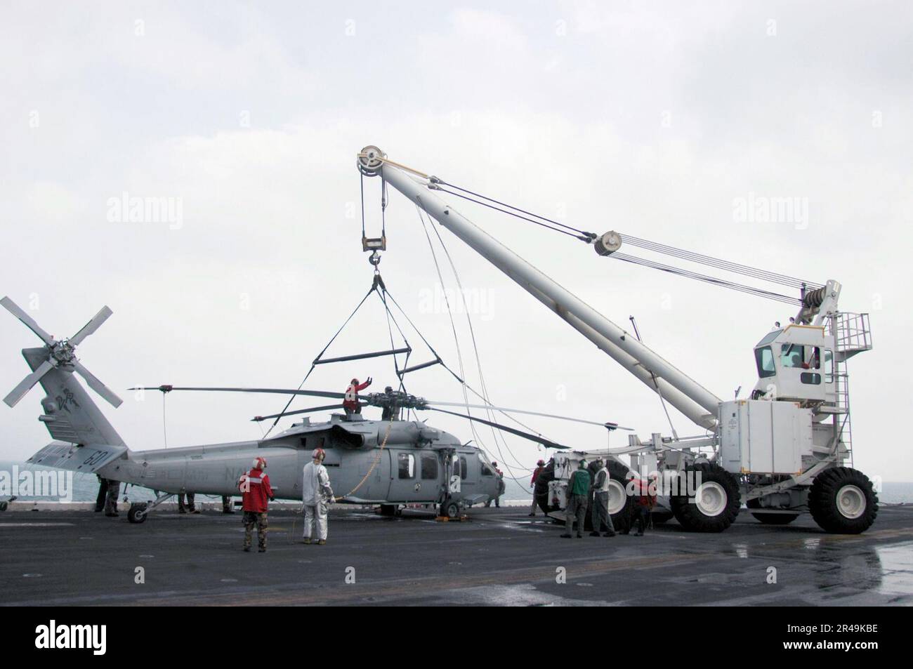 US Navy Members assigned to USS Peleliu (LHA 5) flight deck Crash and ...