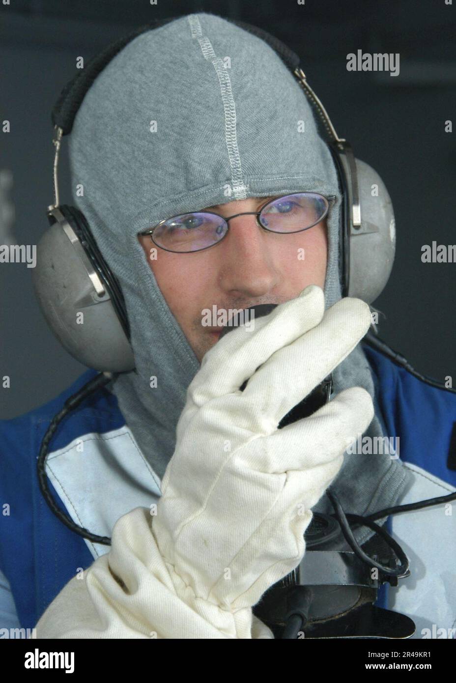 US Navy Sailor aboard USS Enterprise uses soundpowered phones during a