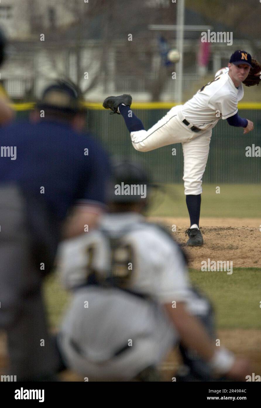 US Navy Midshipman 4th Class Burgess Nichols throws a pitch during the