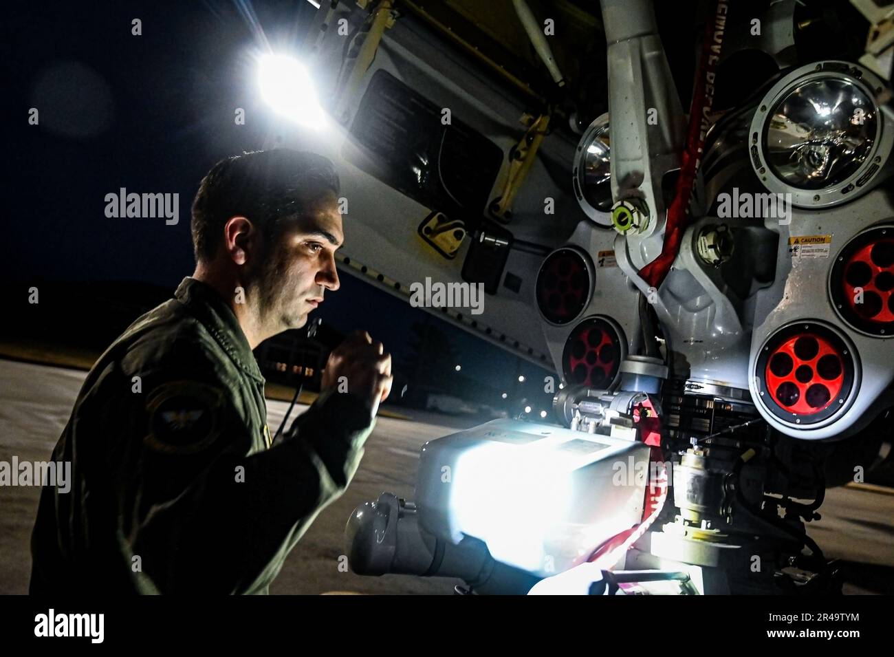 U.S. Air Force Maj. Andrew Kimball, 32nd Air Refueling Squadron pilot, performs a preflight check on a Boeing KC-46A Pegasus Tanker on Jan. 4, 2023 at Joint Base McGuire-Dix-Lakehurst, N.J. The sortie marked the Squadron’s first opportunity to fly a KC-46 local mission from start to finish and execute it exclusively with 32d ARS aircrew. Stock Photo