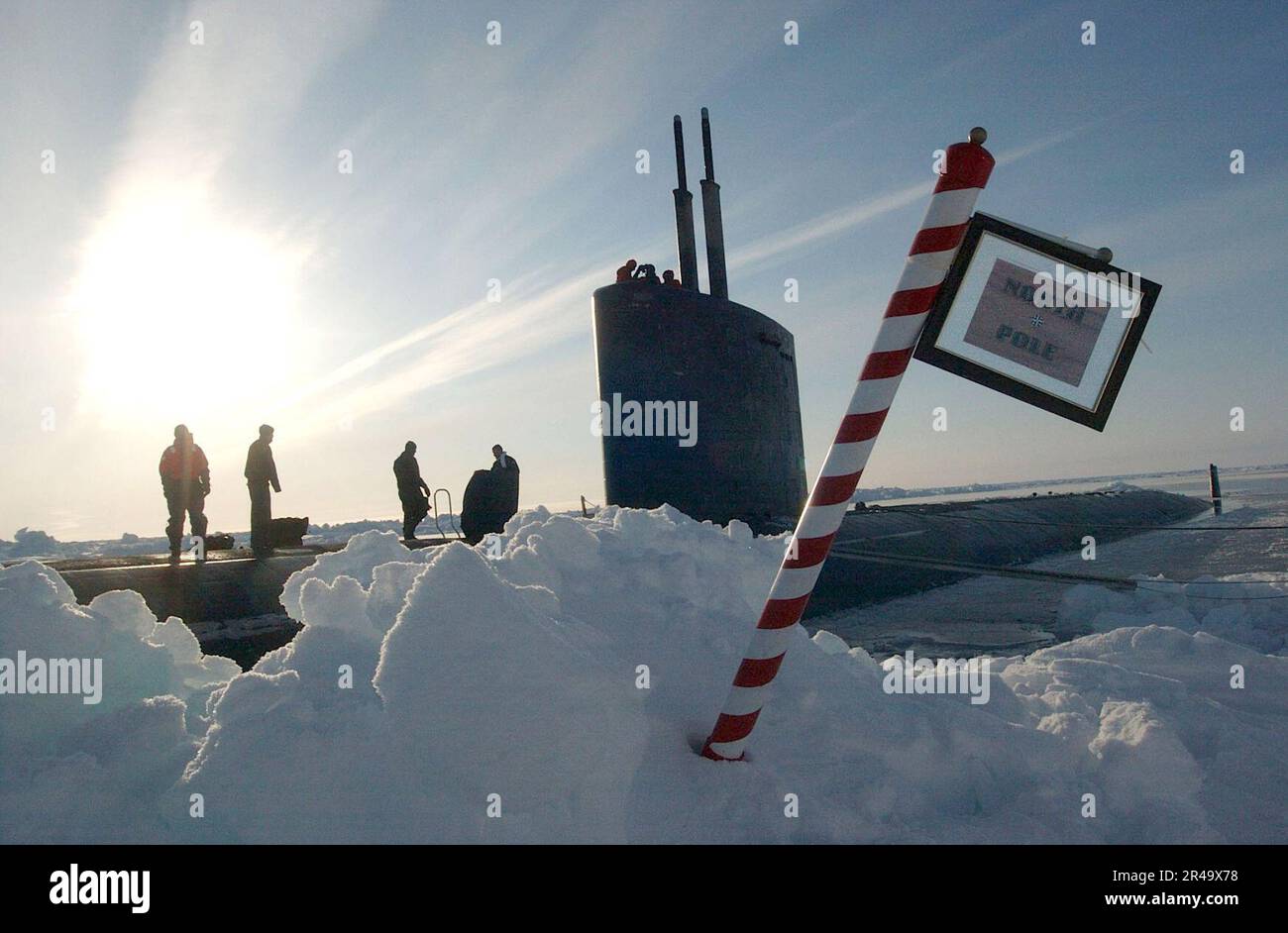 US Navy The crew of the Los Angeles-class attack submarine USS Hampton (SSN 767) posted a sign reading North Pole made by the crew after surfacing in the polar ice cap region Stock Photo