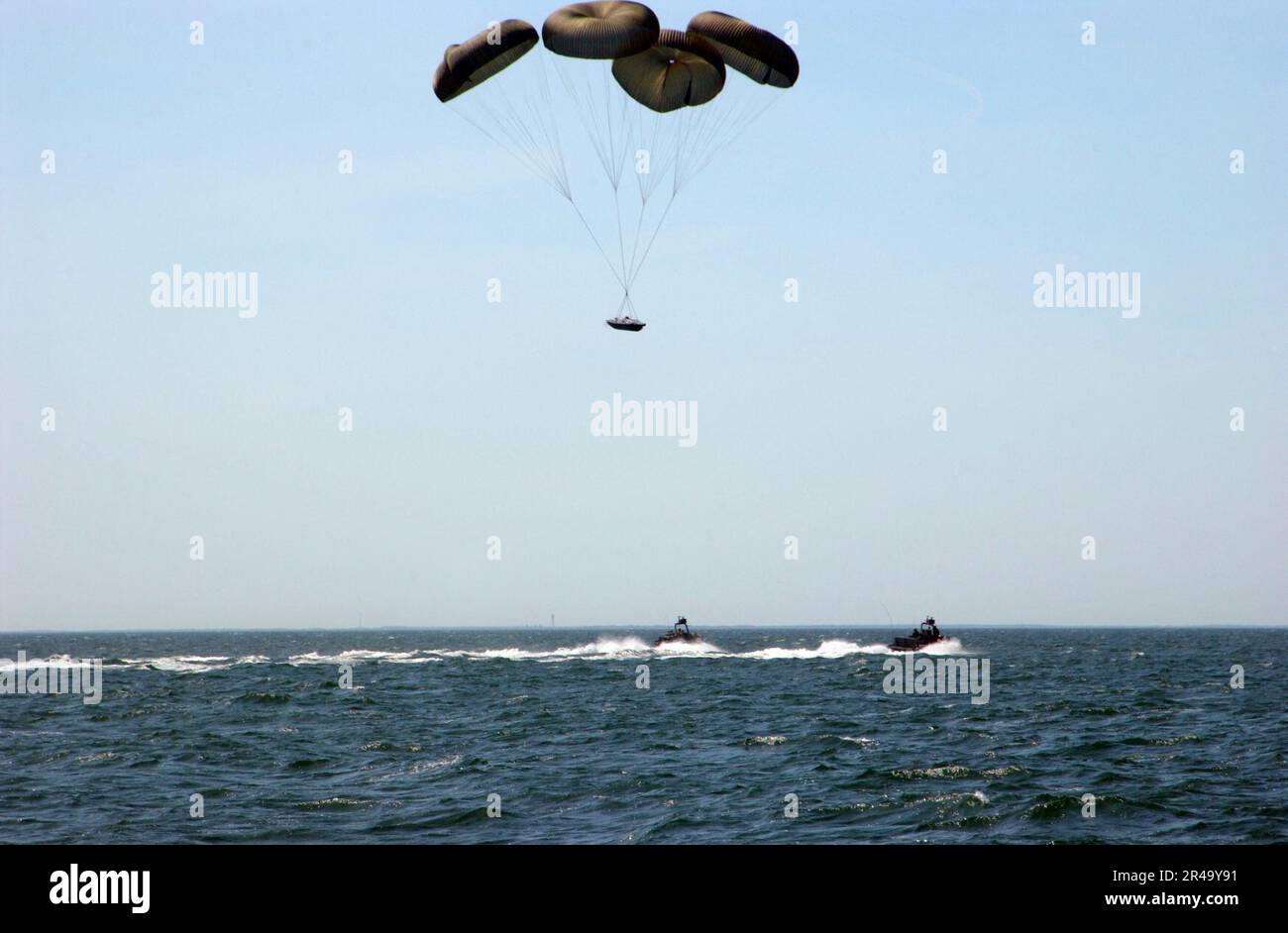 US Navy A Rigid Hull Inflatable Boat (RHIB) approaches the surface of ...