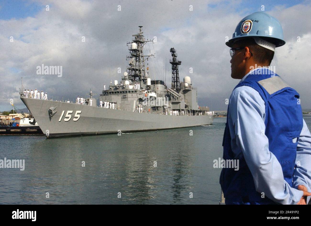 US Navy A Pearl Harbor linehandler watches as the Japanese Maritime
