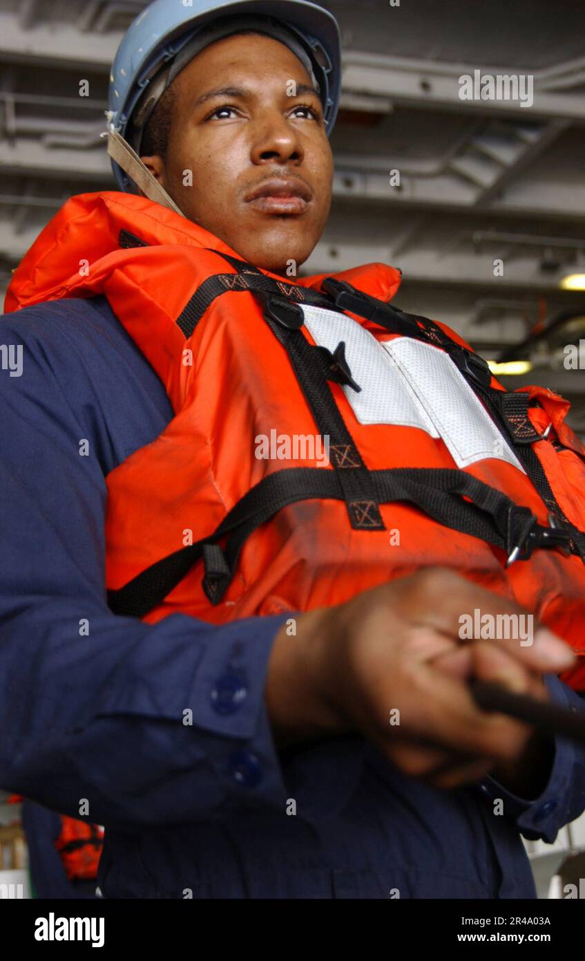 US Navy Seaman keeps tension on a phone line Stock Photo - Alamy