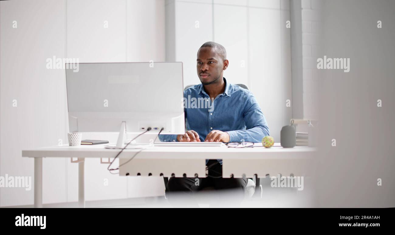 African American Business Man Using PC Computer Stock Photo