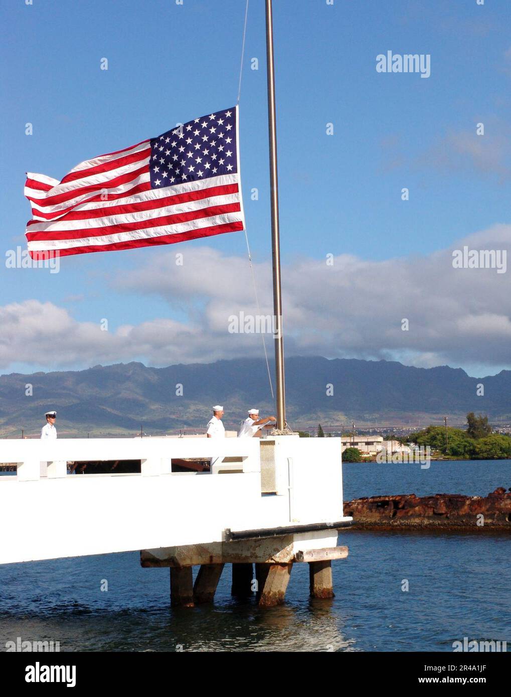 US Navy Sailors Assigned To Ships Based At Pearl Harbor Bring The Flag us-navy-sailors-assigned-to-ships-based-at-pearl-harbor-bring-the-flag