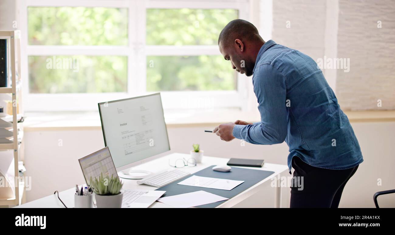 Taking Invoice Document Photo Using Phone Or Smartphone Stock Photo
