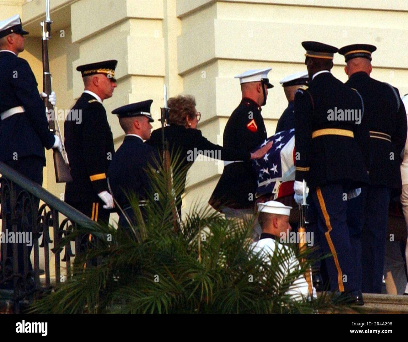 US Navy Former First Lady Nancy Reagan touches the flag-draped casket ...