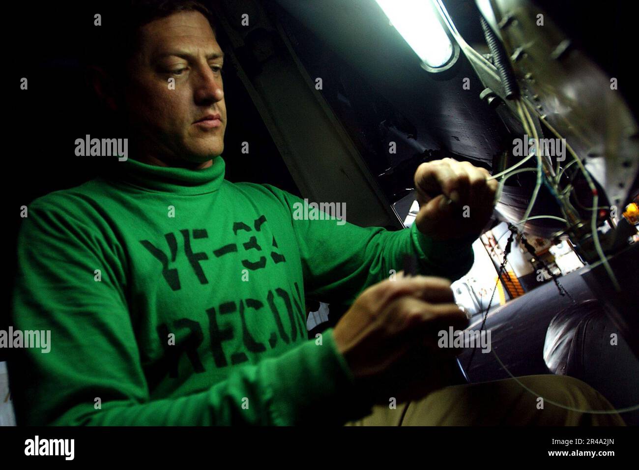 Chief Electronics US Navy Chief Electronics Technician repairs the Airborne Weapons Group ...