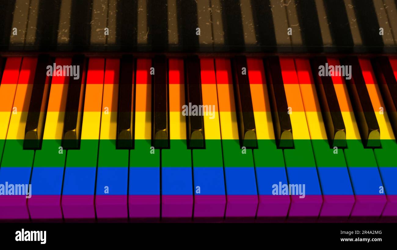 A colorful piano keyboard with keys in hues of rainbow Stock Photo - Alamy