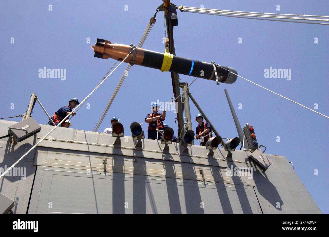US Navy Sailors assigned to the weapons department aboard the guided ...