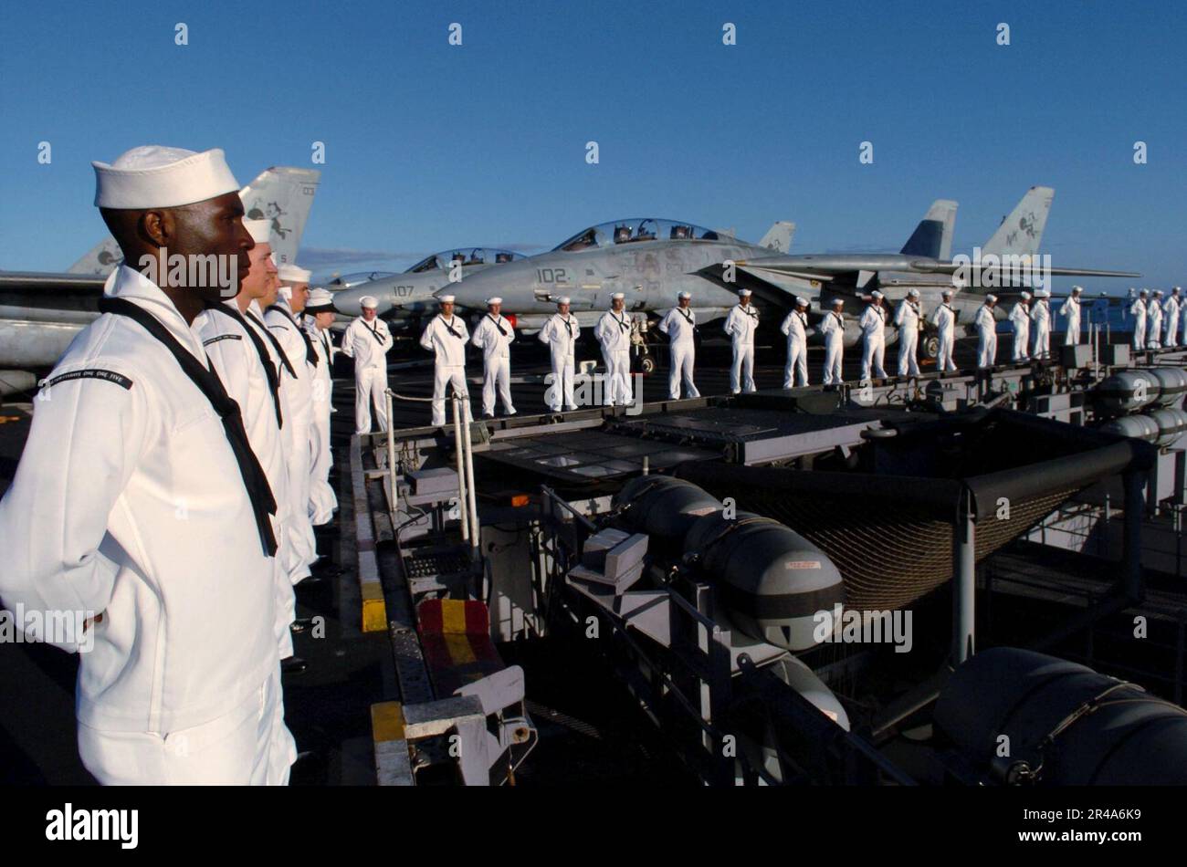 US Navy Sailors man the rails on the flight deck aboard USS John C