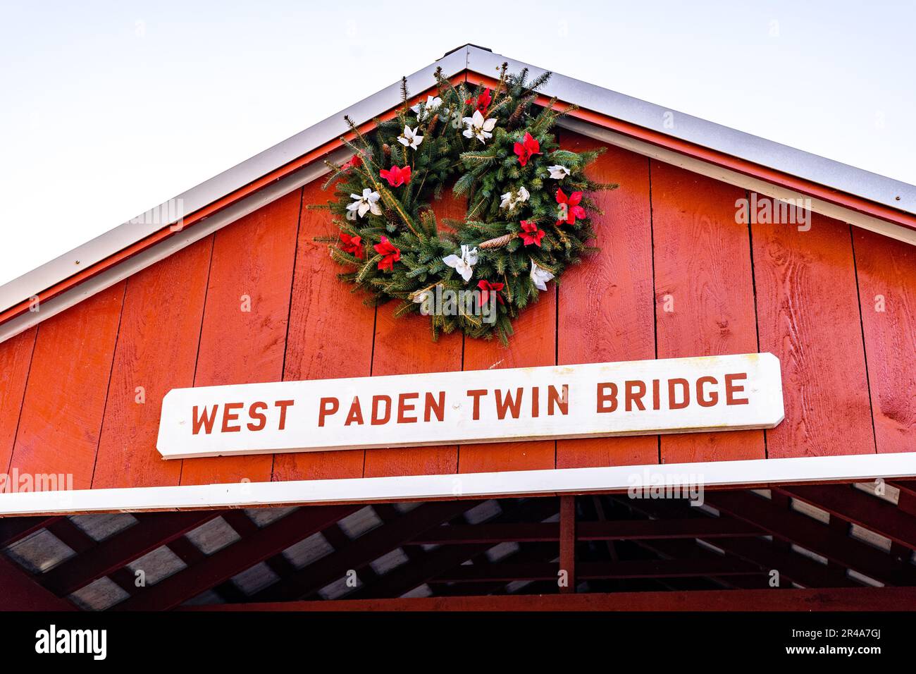 A scenic view of the red East and West Paden Twin Covered Bridges in