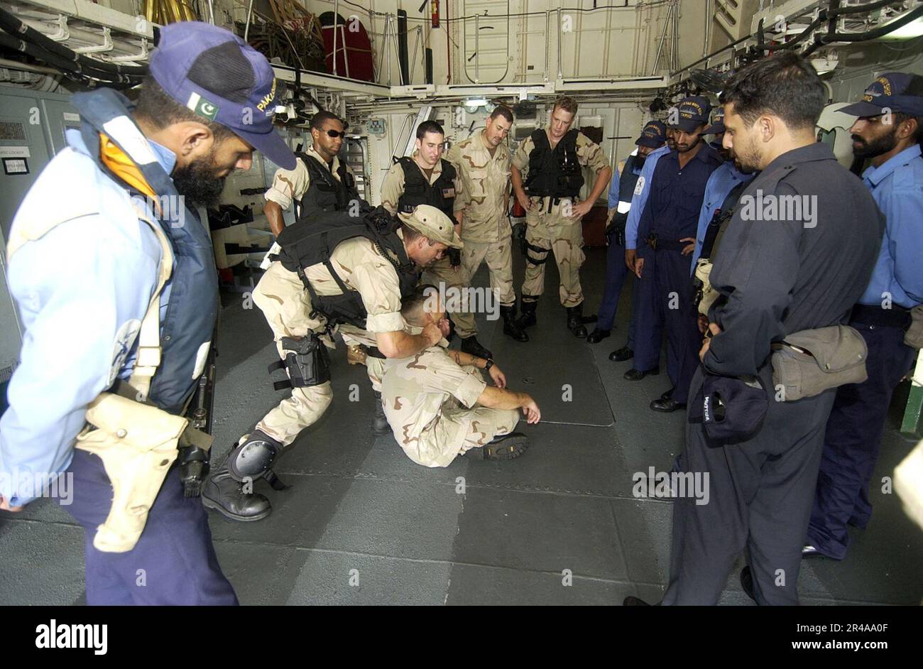 US Navy Sailors assigned to the guided missile destroyer USS Hopper ...
