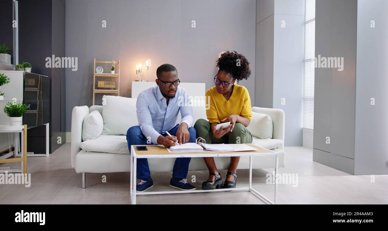 African Couple Doing Financial Budgeting And Income Taxes Stock Photo