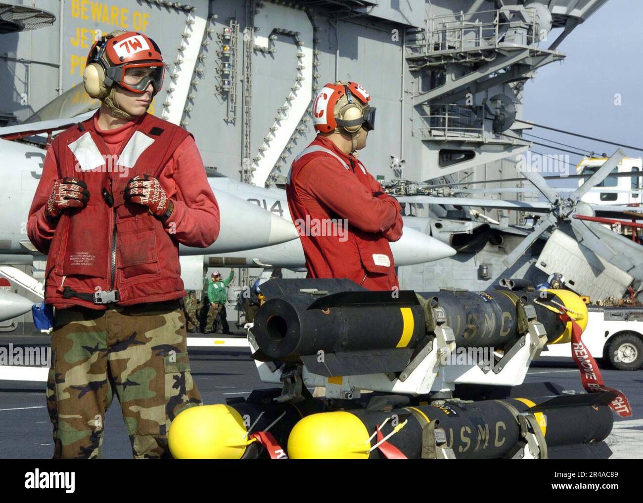 Prior Open Stand US Navy Aviation Ordnancemen stand-by prior to loading AGM-114 Hellfire ...