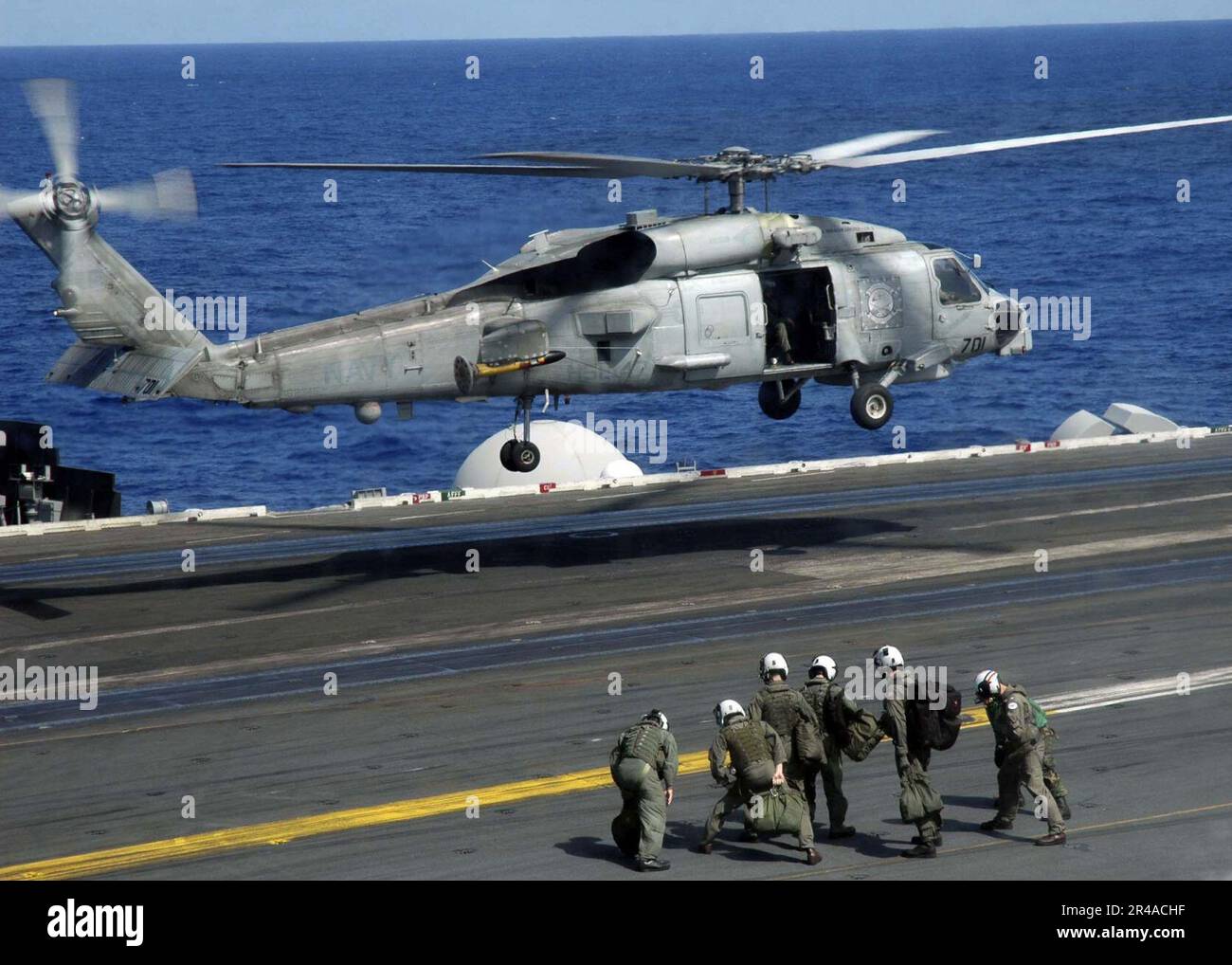 US Navy A SH-60B Seahawk repares to land aboard the Nimitz-class ...