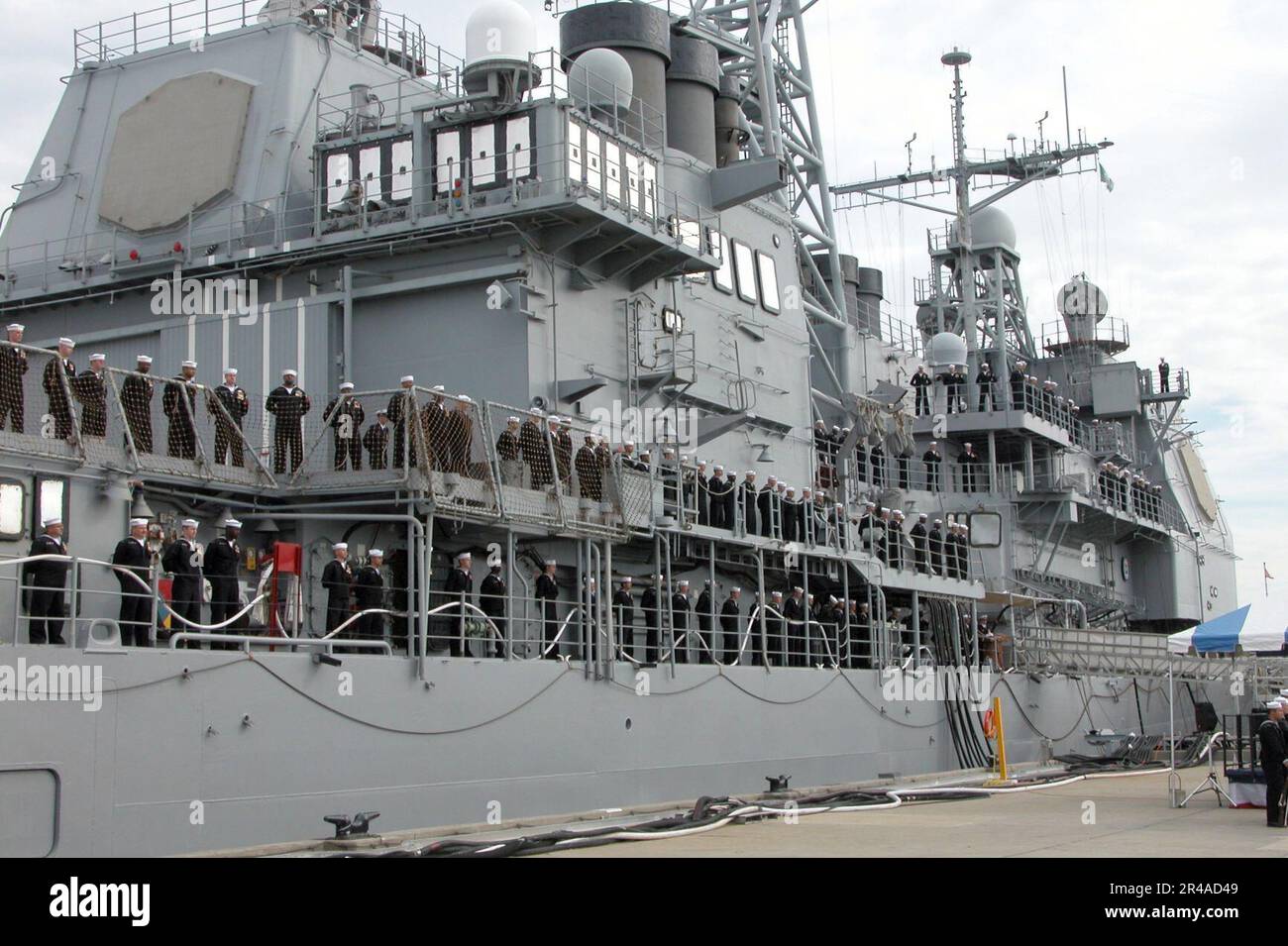 US Navy Crew members assigned to the guided missile cruiser USS