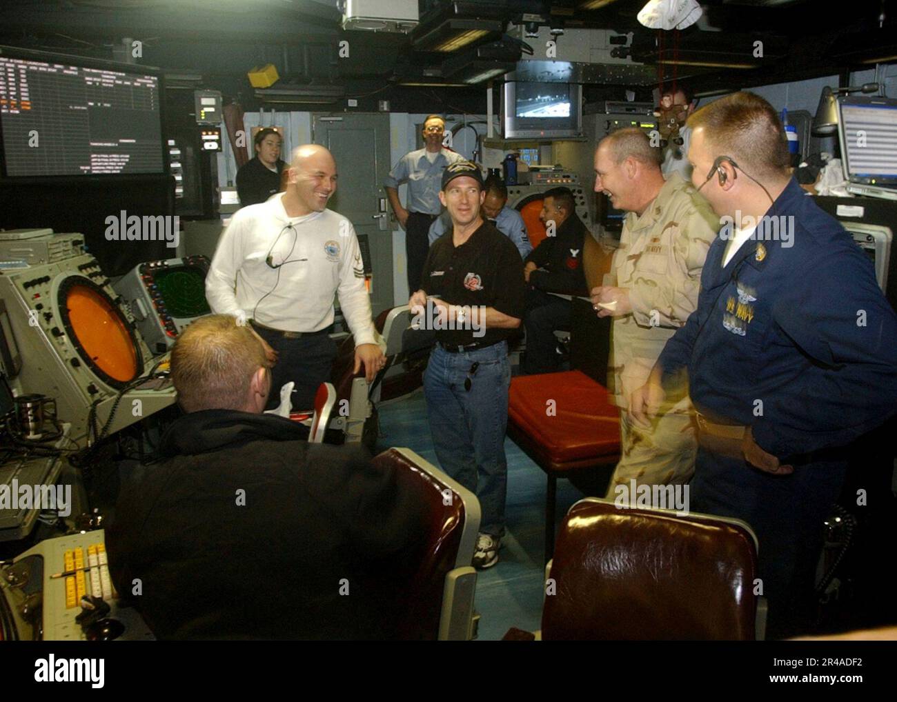 US Navy NASCAR Nextel Cup driver John Andretti pays a visit to the Air Traffic Control crew in the Carrier Air Traffic Control Center (CATCC) aboard the Nimitz-class aircraft carrier USS Harry S. Truman (CVN Stock Photo