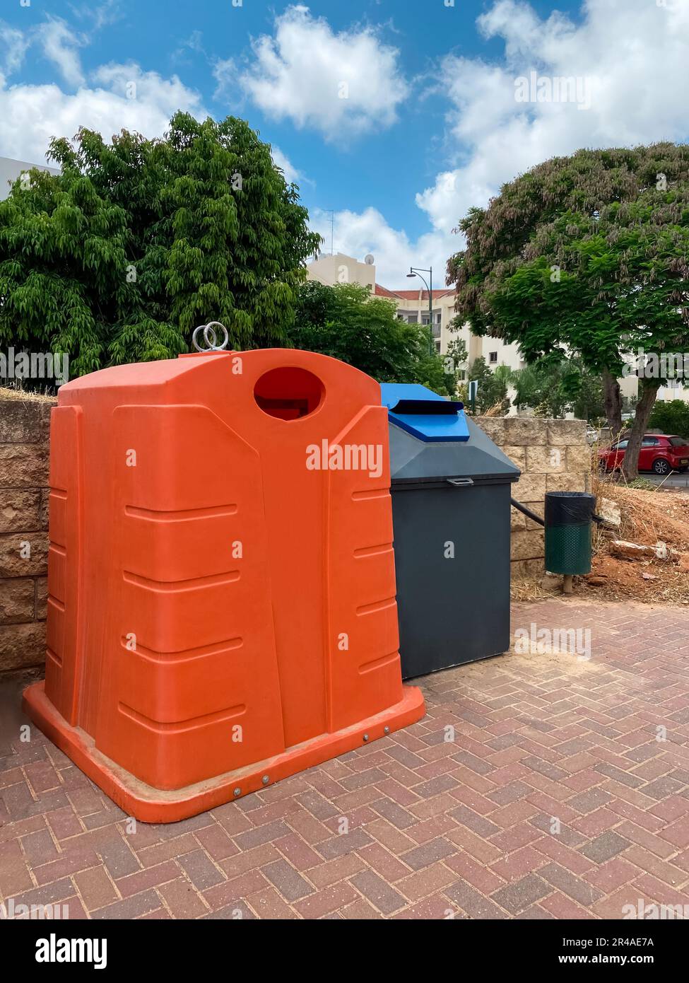 Garbage containers on city street Stock Photo Alamy